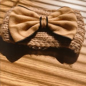 Chunky knit ear warmer with huge decorative bow.